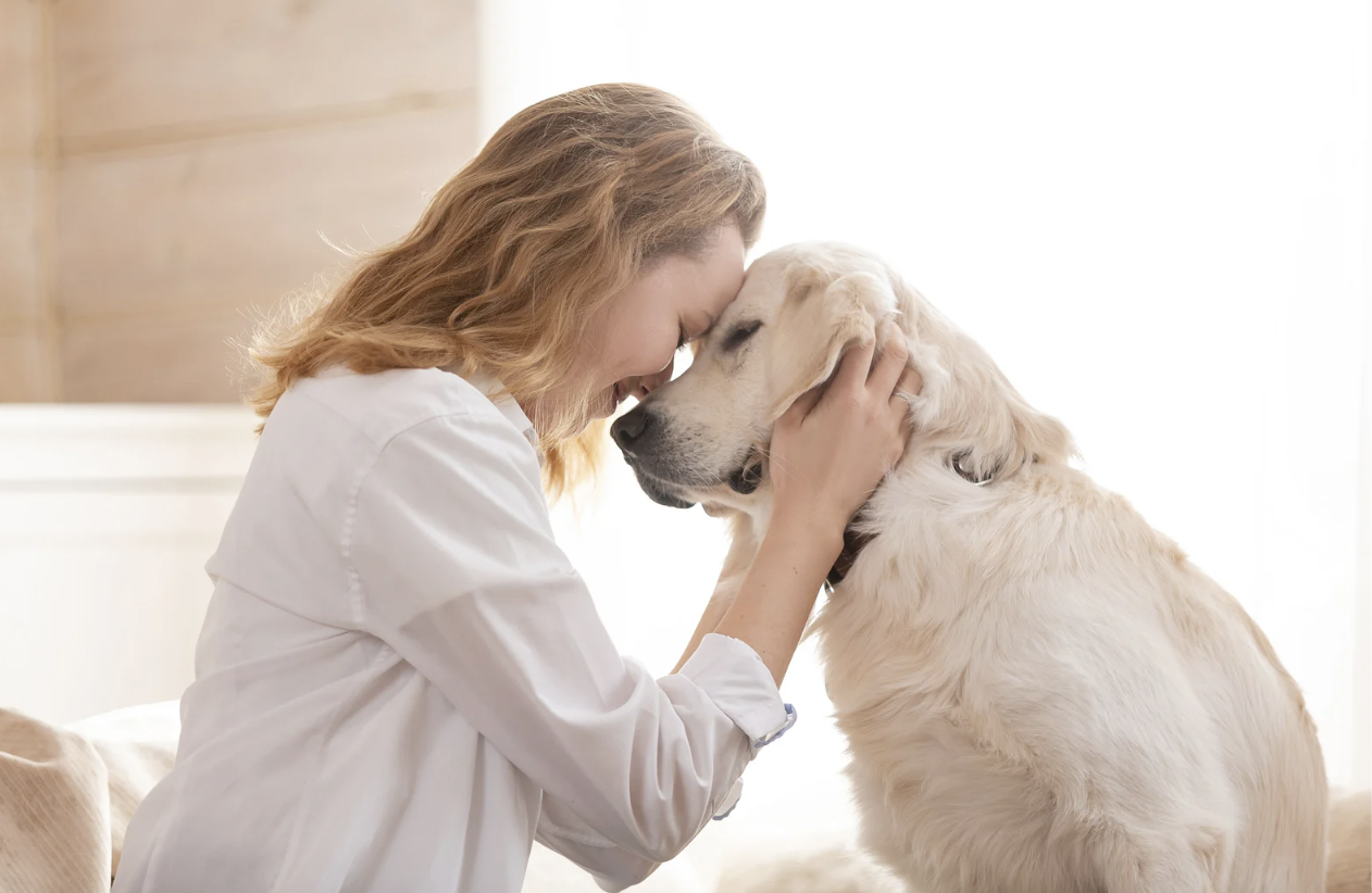 Women and Dog sharing a tender moment demonstrating the Positive Impact of Animal Companionship on Mental Health highlighting the benefits from animal interactions.